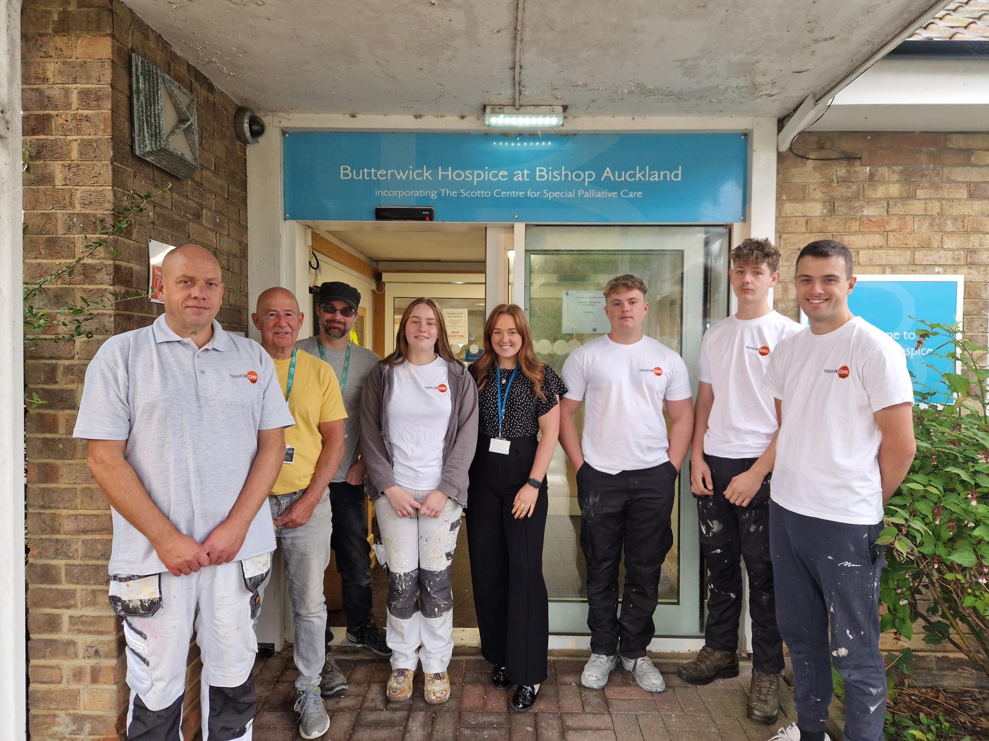 Students and butterwicj hospice staff posed outside of hospice