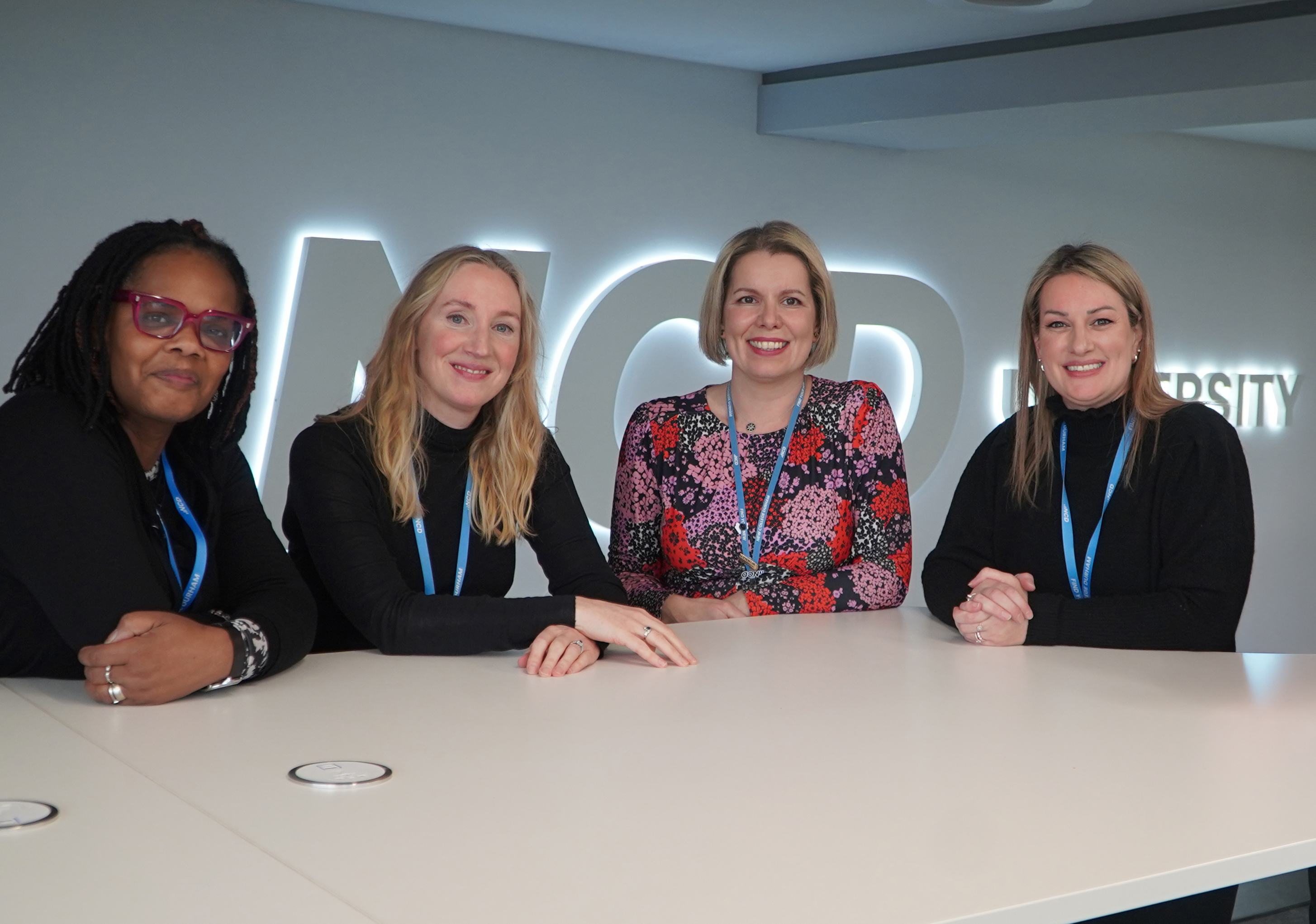 Social Work team photographed around a table in NCD University Centre