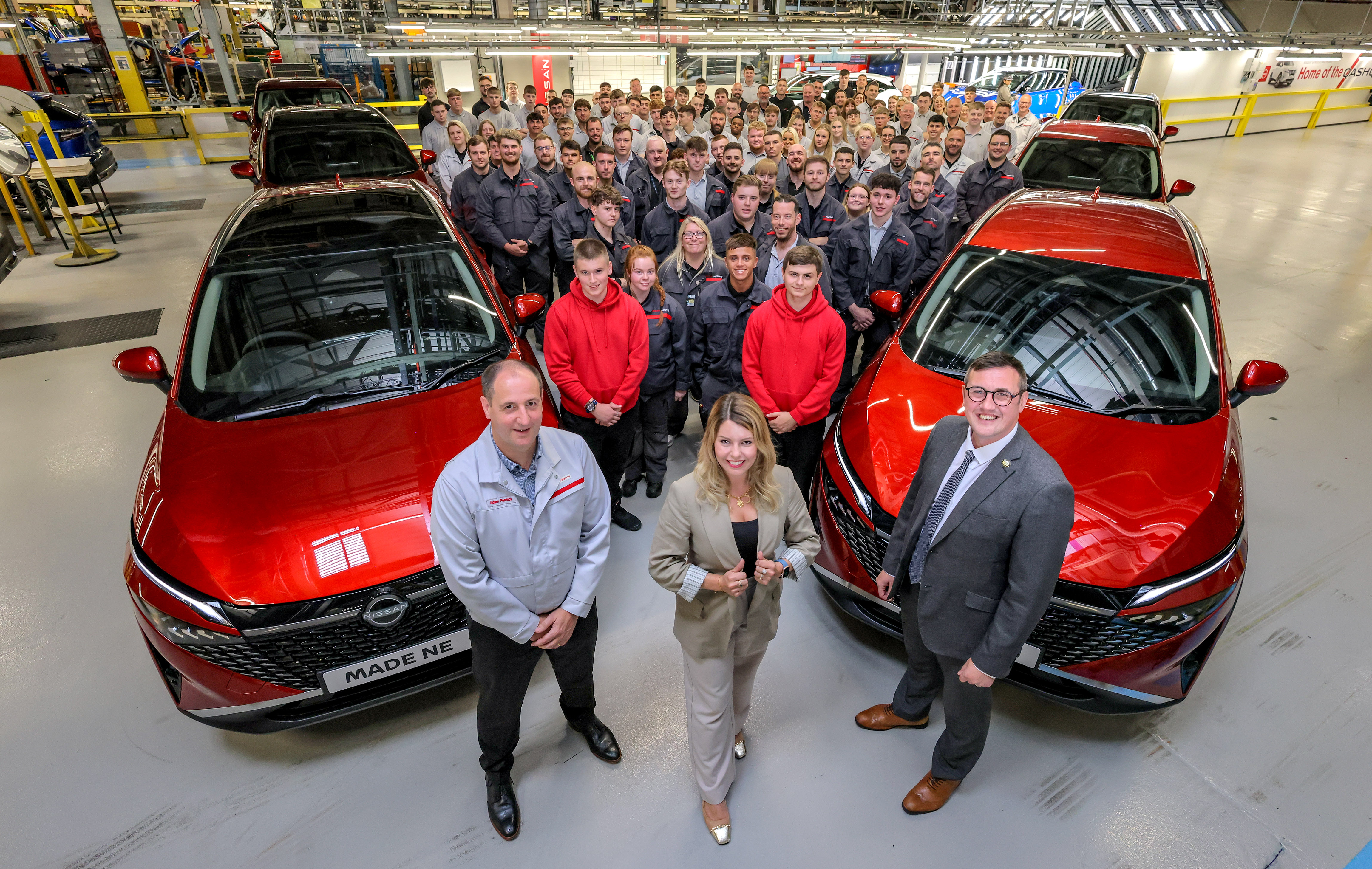 Adam Pennick, Vice President, Manufacturing, Nissan Sunderland Plant; North East Mayor Kim McGuinness; Leader of Sunderland City Council Cllr Michael Mordey; in the background are members of the Nissan Skills Academy, and current and former apprentices. 